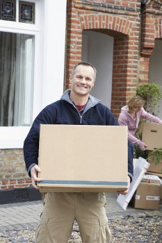 Professional flat removals in Harrow with moving boxes and furniture