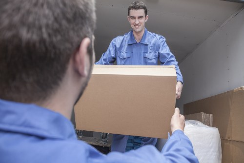 Professional movers handling furniture during a Harrow relocation