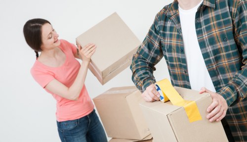 Moving van and packed boxes for removals in Harrow