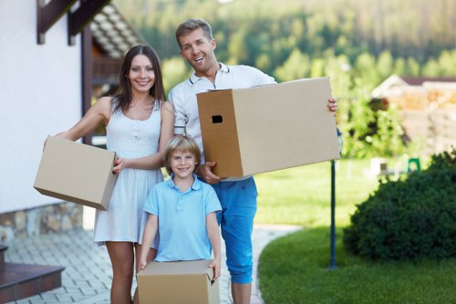 Removal team transporting furniture during a Harrow house move
