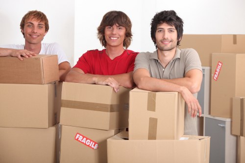 Office relocation scene with desks and equipment in Harrow