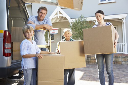 Moving team loading furniture for a Harrow removals service