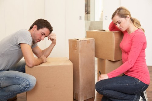 Professional movers handling household items during a Harrow relocation