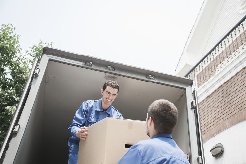 Professional movers handling office relocation equipment in Harrow