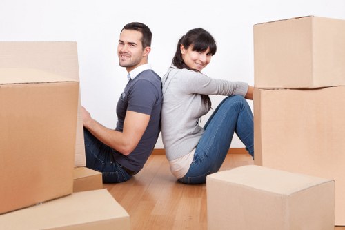 Careful loading of large furniture into a removal van